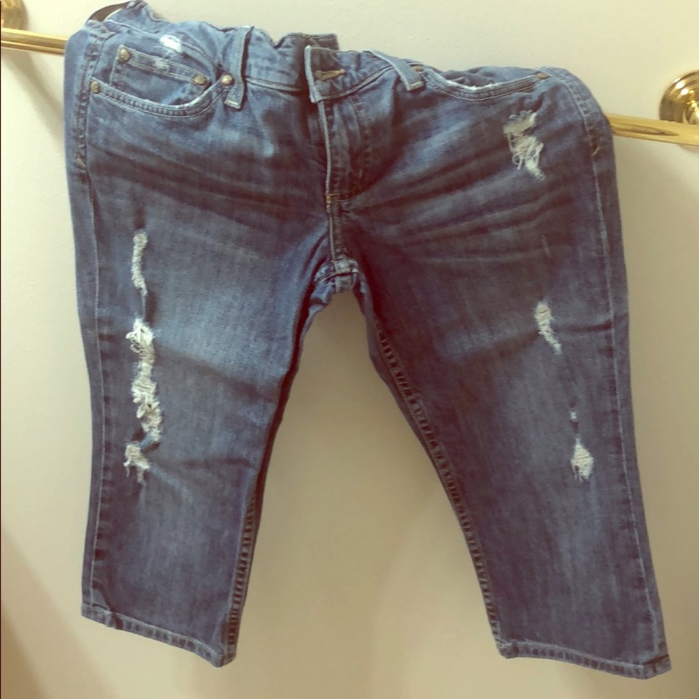 Ripped jeans, capris length. Juicy Couture